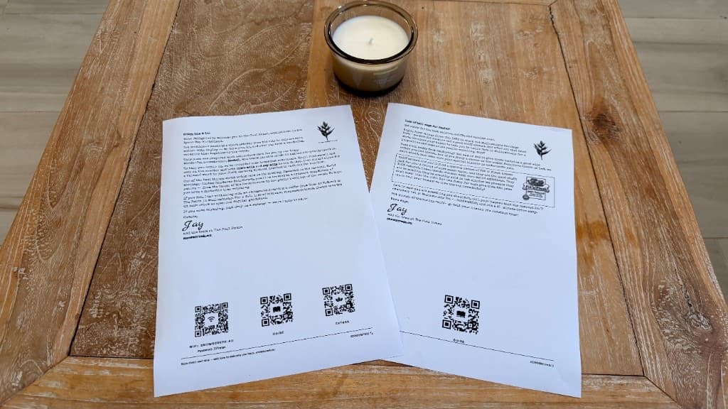 A personalized Guest Jotto welcome letter with a Doggo Jotto and treats waiting on a table at Snows Creek Retreat